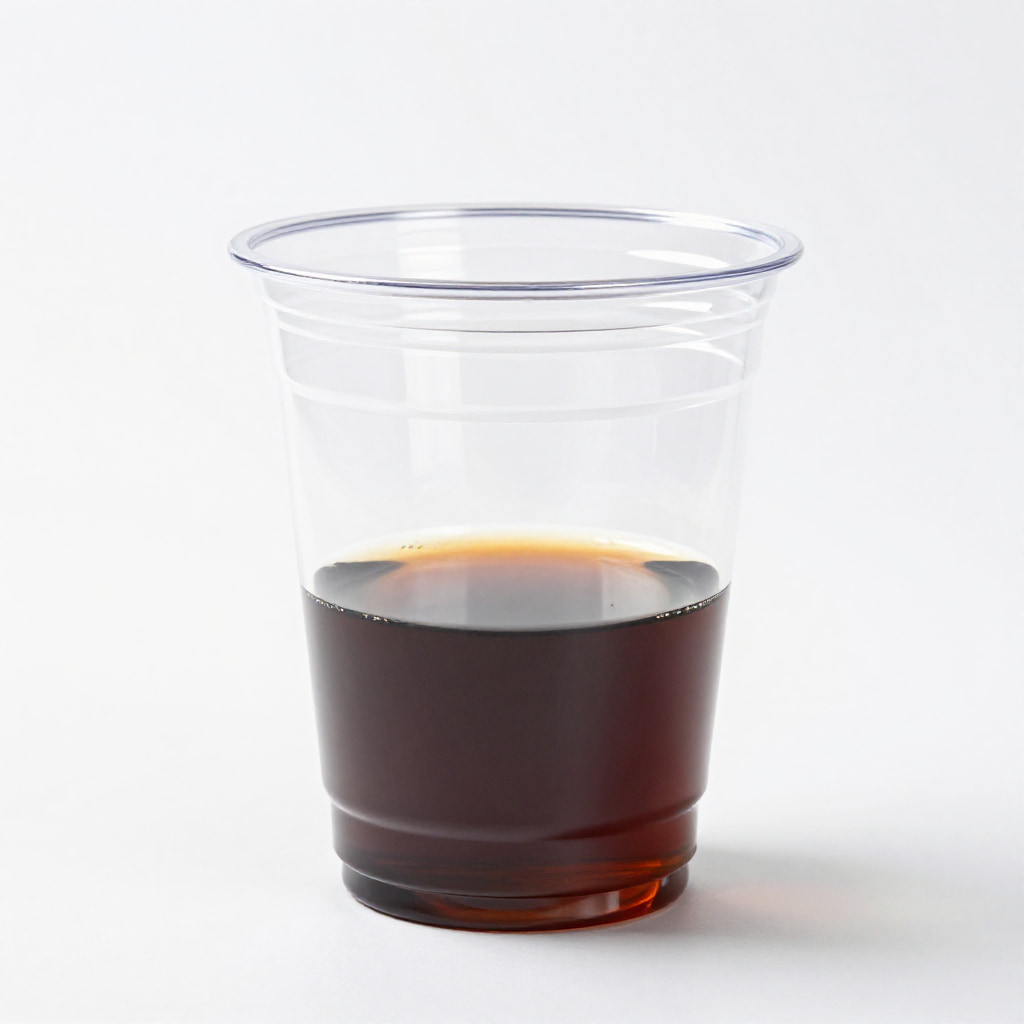 Cup of black coffee on a white studio background.